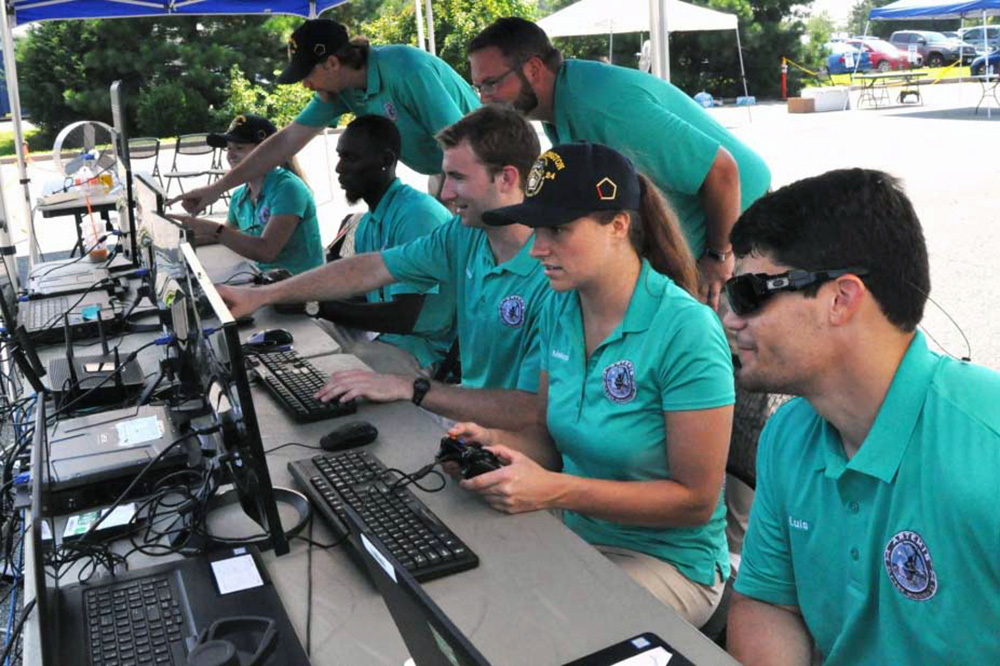 The Naval Surface Warfare Center Dahlgren Division’s Sly Fox Mission 23 team demonstrates autonomous remote tactical engagement multi-domain intelligence swarm capabilities, in Dahlgren, VA., Aug. 7, 2018.