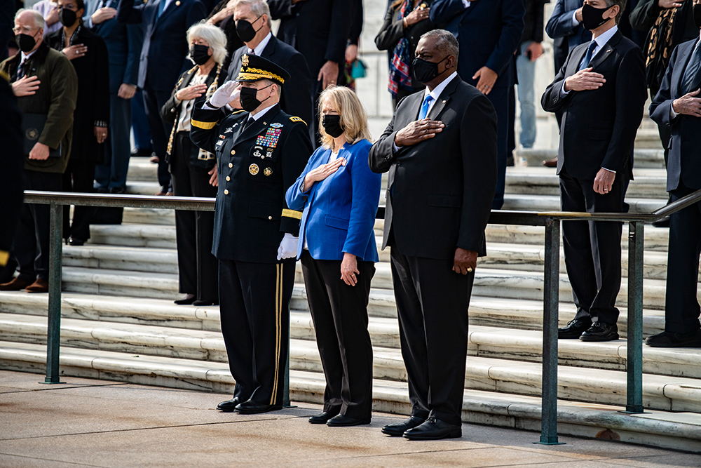 Army Gen. Mark A. Milley, chairman of the Joint Chiefs of Staff, Hollyanne Milley and Secretary of Defense Lloyd Austin III participate in a wreath-laying ceremony as part of the 68th National Veterans Day Observance at the Tomb of the Unknown Soldier at Arlington National Cemetery, Va., Nov. 11, 2021.