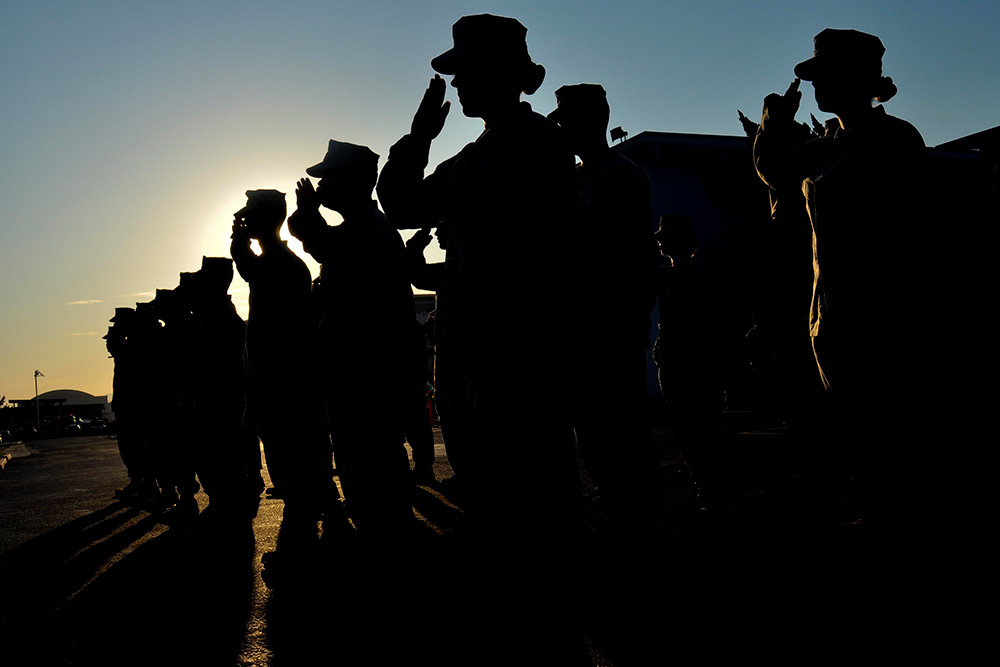 Marines salute during a formation on Marine Corps Air Station Miramar, Calif., Sept 4, 2012.