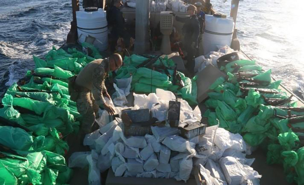 U.S. service members from patrol coastal ship USS Typhoon (PC 5) inventory an illicit shipment of weapons while aboard a stateless fishing vessel transiting international waters in the North Arabian Sea, Dec. 20. © U.S. Navy photo