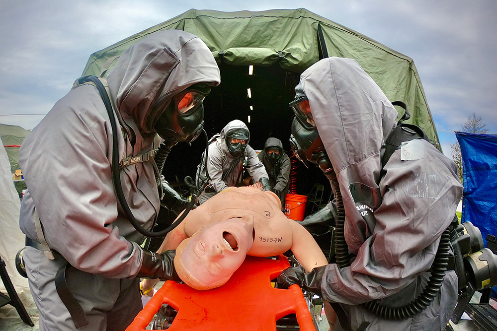 Army National Guard soldiers from the 140th Chemical Company perform mass casualty decontamination operations during a training exercise at the Muscatatuck Urban Training Center in Butlerville, Ind., during Exercise Guardian Response 21, April 23, 2021. © Army Sgt. 1st Class Brent C. Powell