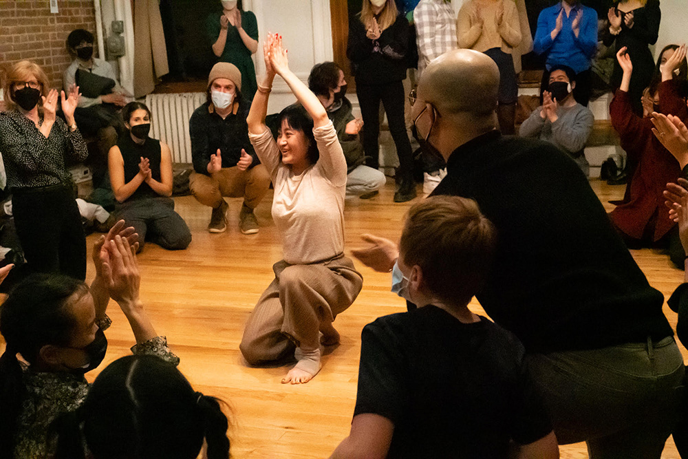 Jiali Wang dances with the audience at the 7MPR Themed Dance Theater-The First Midnight Performance, Arts On Site, NYC, © Christine Abbate, 2022