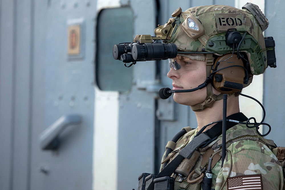 A sailor assigned to Explosive Ordnance Disposal Mobile Unit (EODMU 6), maintains security on the flight deck of the USS Normandy during training in the Adriatic Sea, Oct. 30, 2023.