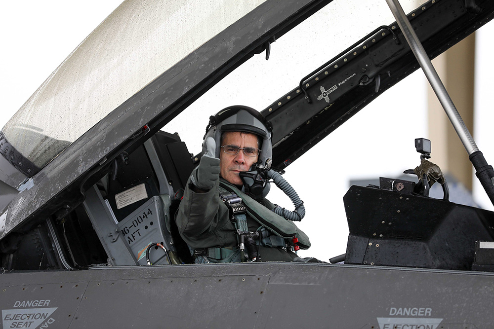 Air Force Lt. Gen. Marc Sasseville, vice chief, National Guard Bureau, gives a thumbs-up signal as he prepares to ride in an F-16 Fighting Falcon piloted by Lt. Col. Todd Gibson, 113th Wing, District of Columbia National Guard, at Joint Base Andrews, Md., May 15, 2024, marking the final flight of Sasseville's career. © Army Sgt. 1st Class Zach Sheely