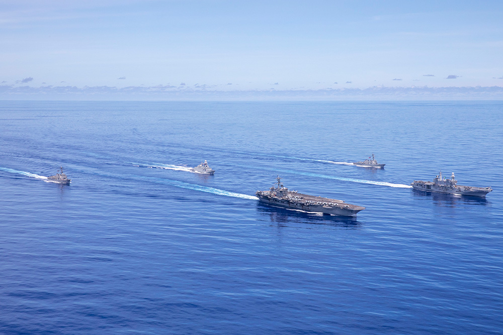 The USS Abraham Lincoln Carrier Strike Group and the Italian Cavour Carrier Strike Group sail in formation, Aug.8, 2024. The two navies held the first-ever bilateral Multi-Large Deck Event in the Indo-Pacific. © Navy Petty Officer 1st Class Jerome D. Johnson