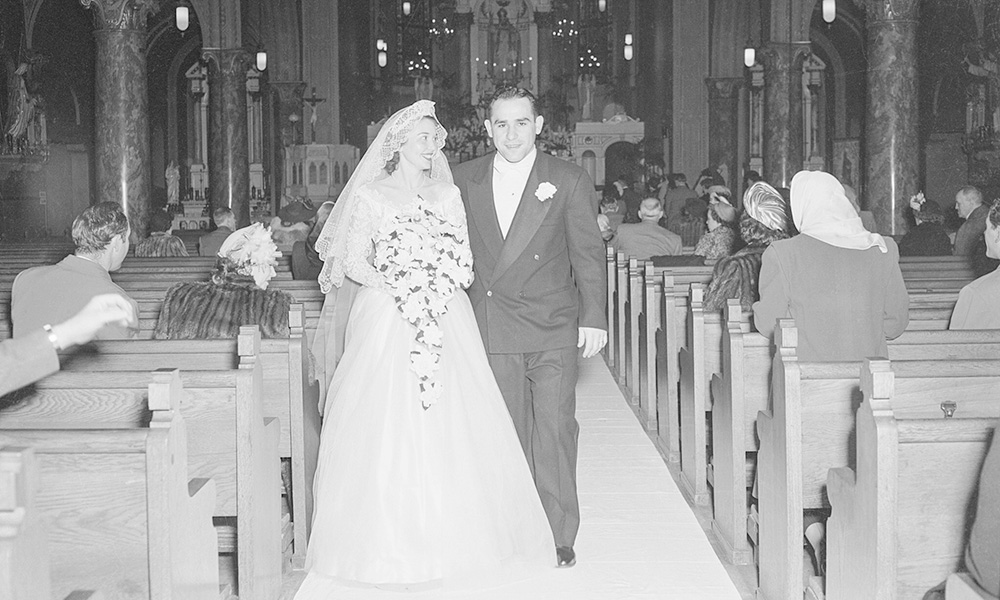 Lawrence Peter 'Yogi' Berra, born Lorenzo Pietro Berra, and Carmen Short celebrate their wedding on January 26, 1949, at St. Ambrose Catholic Church in The Hill neighborhood of St. Louis, Missouri. Their marriage spanned 65 years, a beautiful testament to their unwavering love and commitment. Photos are courtesy of the Berra Family.