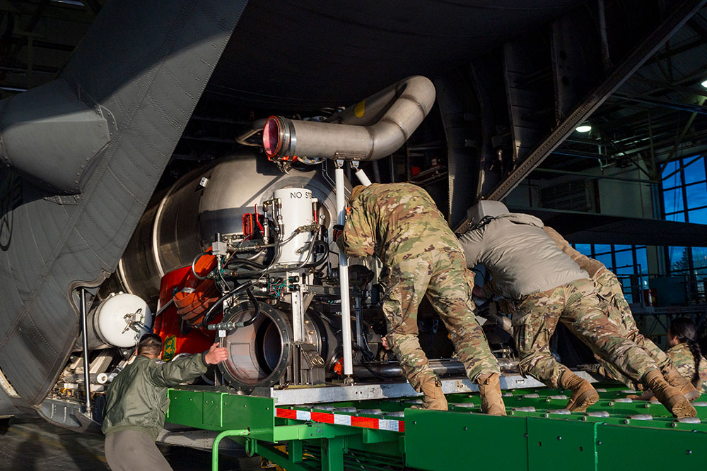 Airmen assigned to the 153rd Airlift Wing load and install the Modular Airborne Fire Fighting Systems onto a C-130H Hercules aircraft in Cheyenne, Wyoming, Jan. 10, 2025, in preparation to support firefighting efforts in the Los Angeles area. © Air Force Senior Airman Zachary Herold