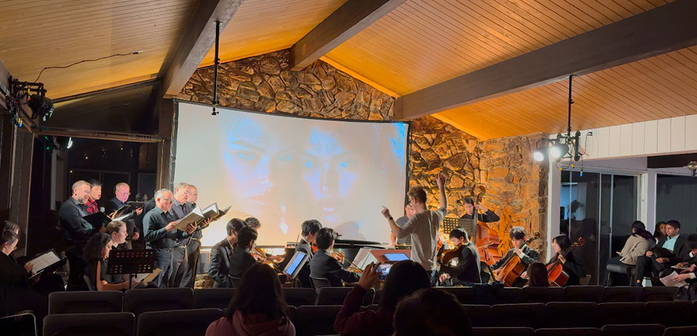 The Oclef Chamber Orchestra, conducted by Dr. Matthew Bell, performs alongside the San Jose Symphonic Chorale and Oclef’s top 24 Stage 4 pianists in a powerful collaboration at 8VA Hall in San Jose, California. This landmark performance took place in January 2025, showcasing the depth of musical excellence within Oclef.